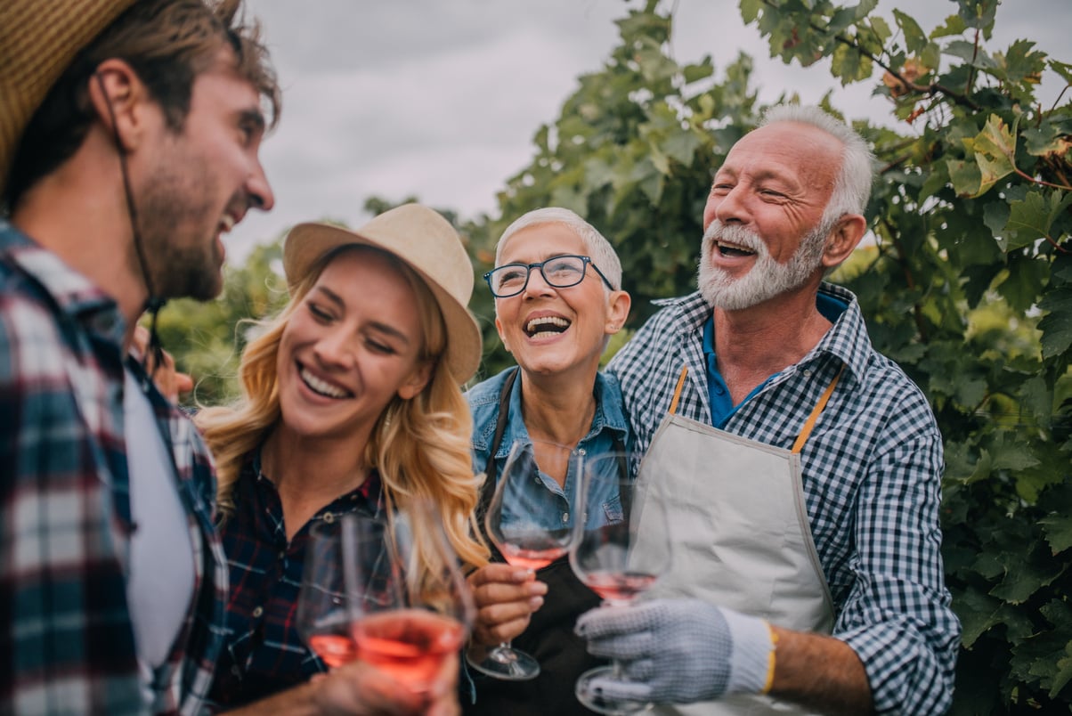 Happy people drinking wine